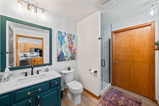 507 E Locust St Unit 308, Des Moines, IA 50309 - full bath with vanity, wood finished floors, and a stall shower