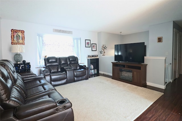 204 25th Ave SW, Altoona, IA 50009 - living area featuring dark wood-style flooring and baseboards