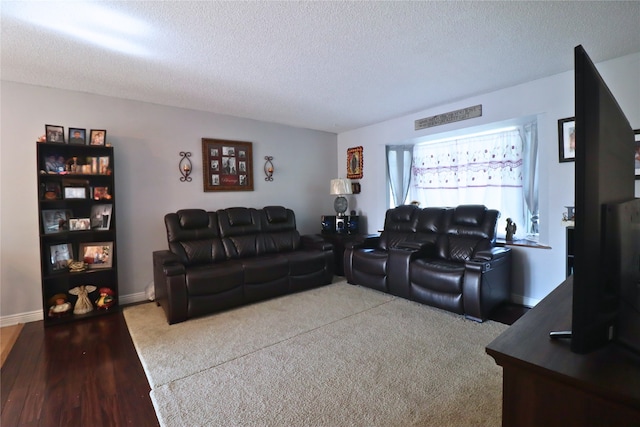 204 25th Ave SW, Altoona, IA 50009 - carpeted living room featuring a textured ceiling and baseboards