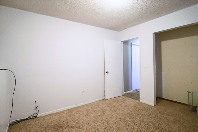 204 25th Ave SW, Altoona, IA 50009 - unfurnished bedroom featuring carpet and a textured ceiling