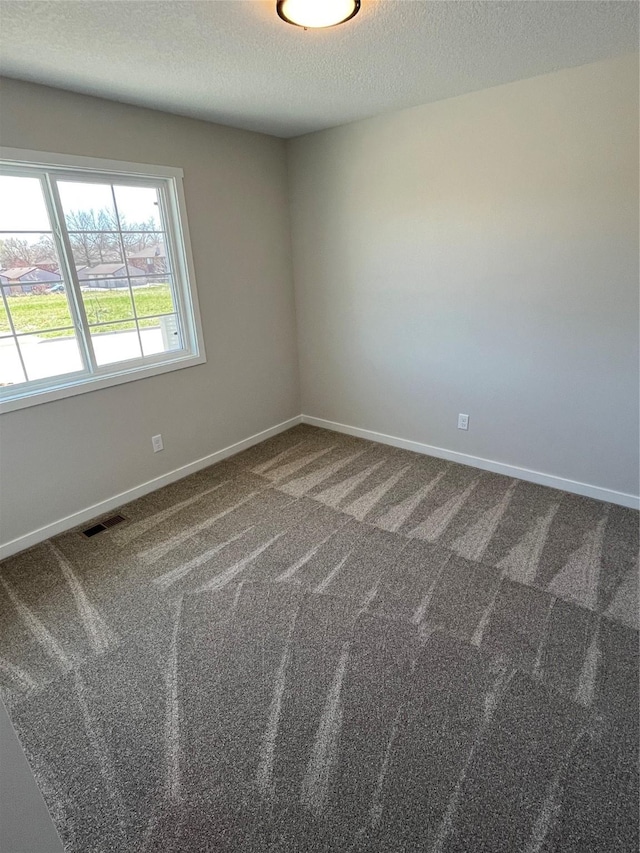 711 W N Ave, Norwalk, IA 50211 - carpeted spare room with a textured ceiling and baseboards