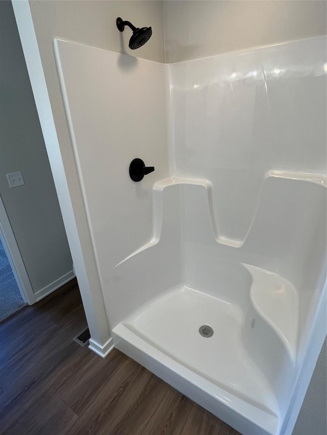 711 W N Ave, Norwalk, IA 50211 - full bath with wood finished floors and a shower