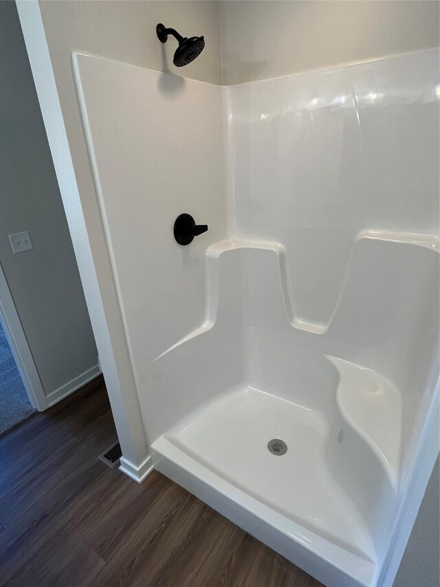 711 W N Ave, Norwalk, IA 50211 - full bath with wood finished floors and a shower