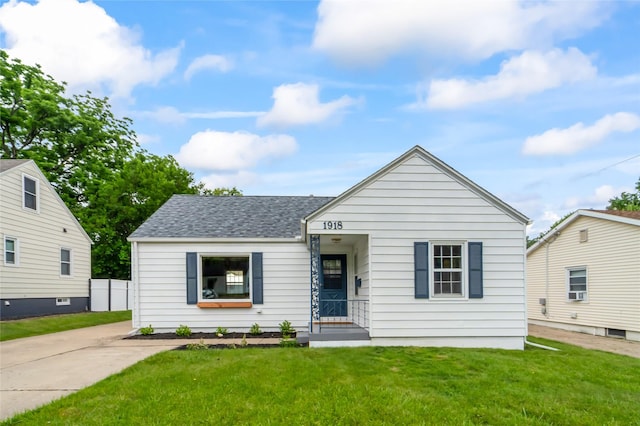 1918 55th St, Des Moines, IA 50310 - bungalow-style home with a front yard and roof with shingles