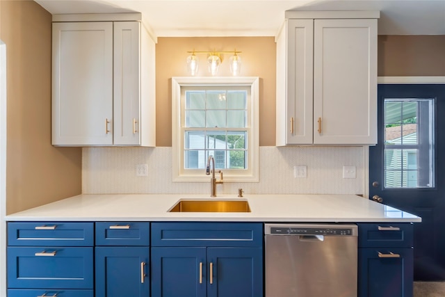 1918 55th St, Des Moines, IA 50310 - kitchen featuring dishwasher, blue cabinets, and light countertops