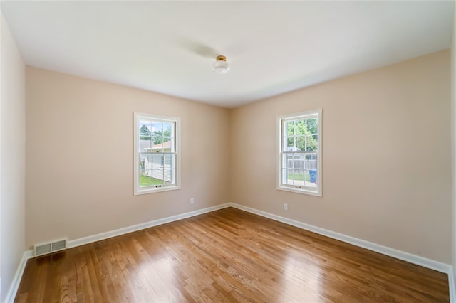 1918 55th St, Des Moines, IA 50310 - unfurnished room with wood finished floors and baseboards