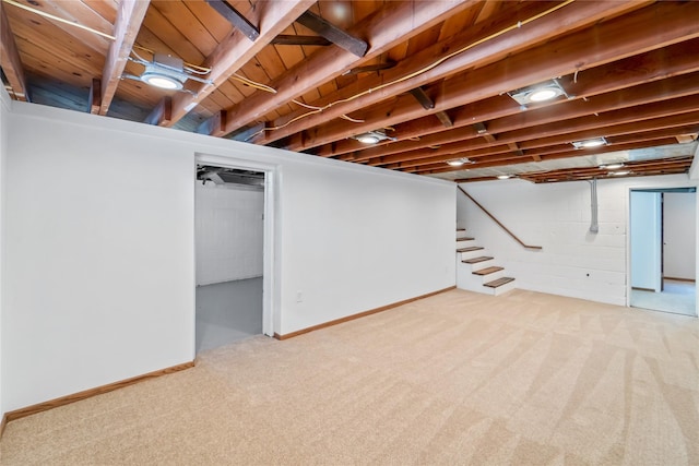 1918 55th St, Des Moines, IA 50310 - finished basement featuring carpet, stairway, and concrete block wall