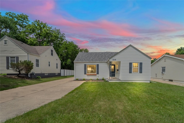 1918 55th St, Des Moines, IA 50310 - view of front of house with a front yard and a shingled roof