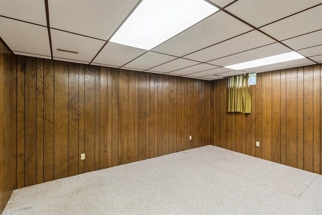 2907 Northwood Dr, Ames, IA 50010 - finished basement featuring a paneled ceiling, carpet, and wooden walls