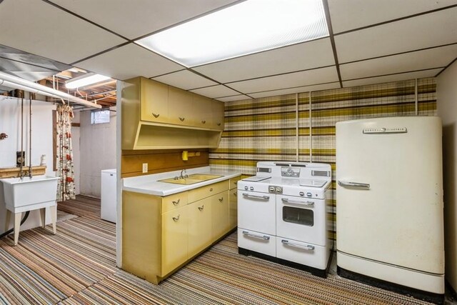 2907 Northwood Dr, Ames, IA 50010 - kitchen with white appliances, washing machine and dryer, light countertops, a paneled ceiling, and carpet