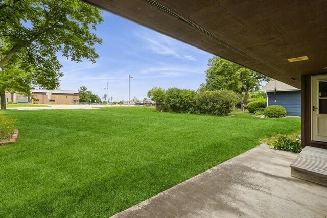 2907 Northwood Dr, Ames, IA 50010 - view of grassy yard featuring a patio area
