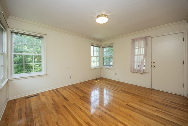 5800 Pleasant Dr, Des Moines, IA 50312 - empty room with ornamental molding and light wood-style floors