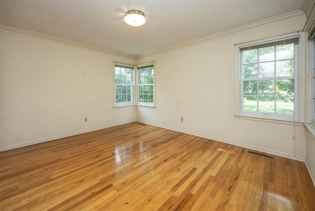 5800 Pleasant Dr, Des Moines, IA 50312 - unfurnished room with light wood finished floors and crown molding
