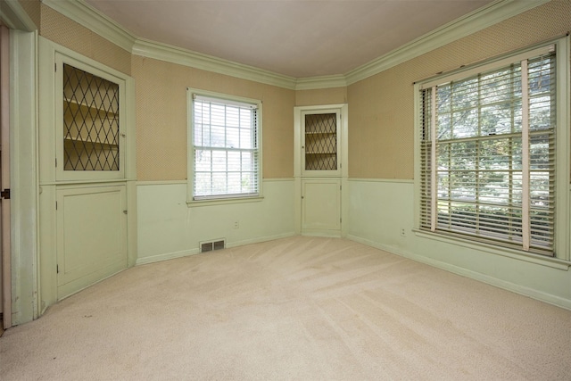 5800 Pleasant Dr, Des Moines, IA 50312 - carpeted spare room with ornamental molding and a wainscoted wall