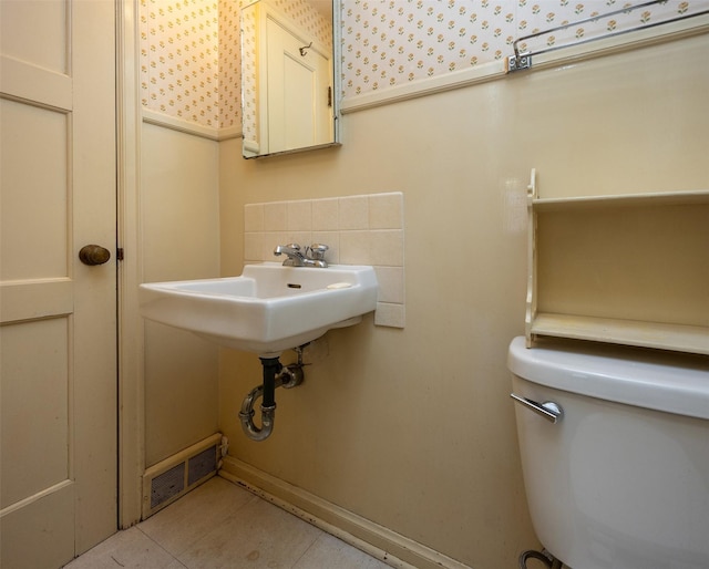 5800 Pleasant Dr, Des Moines, IA 50312 - bathroom with backsplash and tile patterned flooring