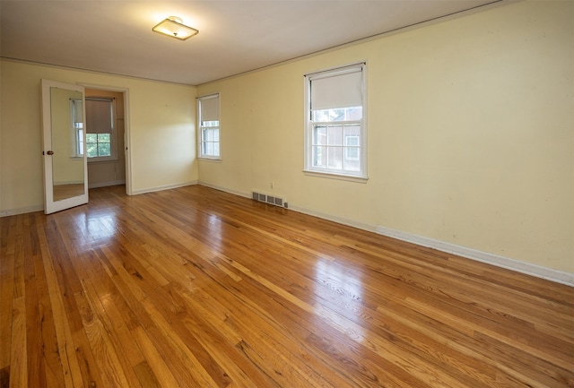 5800 Pleasant Dr, Des Moines, IA 50312 - unfurnished room featuring healthy amount of natural light and wood finished floors