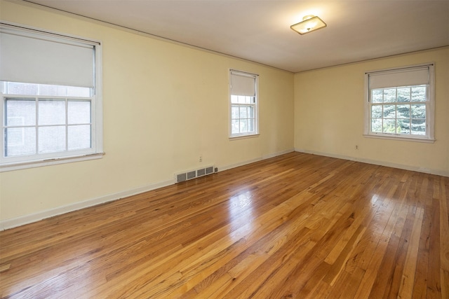 5800 Pleasant Dr, Des Moines, IA 50312 - unfurnished room with plenty of natural light and light wood finished floors