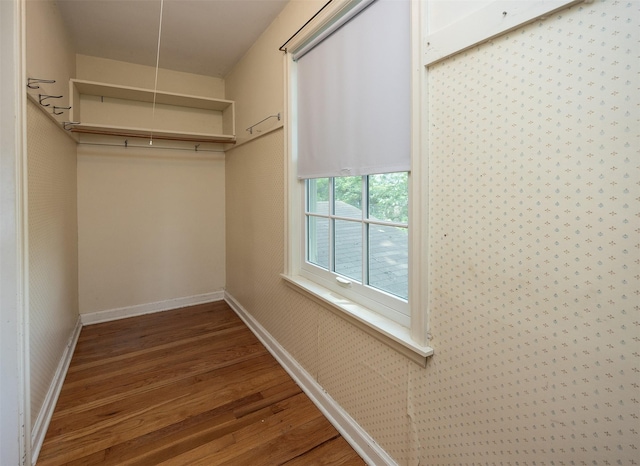 5800 Pleasant Dr, Des Moines, IA 50312 - walk in closet featuring wood finished floors