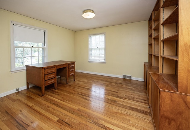 5800 Pleasant Dr, Des Moines, IA 50312 - office area with light wood-style flooring and baseboards