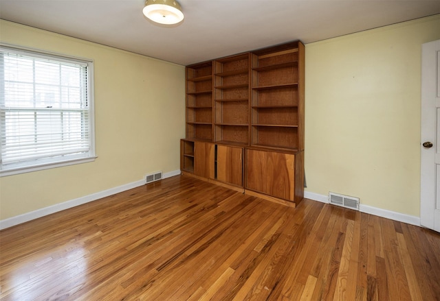 5800 Pleasant Dr, Des Moines, IA 50312 - unfurnished room featuring wood finished floors and baseboards