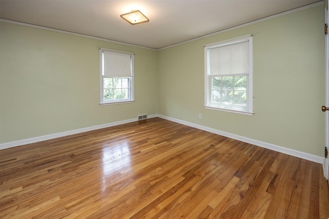 5800 Pleasant Dr, Des Moines, IA 50312 - empty room with crown molding and light wood finished floors