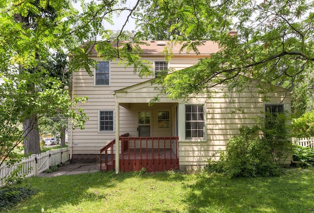 5800 Pleasant Dr, Des Moines, IA 50312 - rear view of house with a fenced backyard