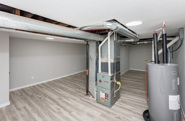 3308 Cambridge St, Des Moines, IA 50313 - finished below grade area with water heater, wood finished floors, and heating unit