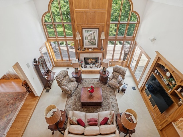 501 S 33rd St, West Des Moines, IA 50265 - living area featuring a towering ceiling and a tile fireplace