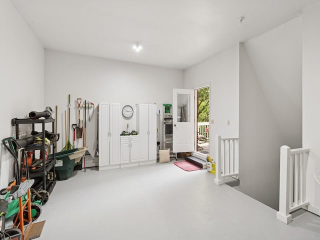 501 S 33rd St, West Des Moines, IA 50265 - miscellaneous room featuring an upstairs landing and concrete floors
