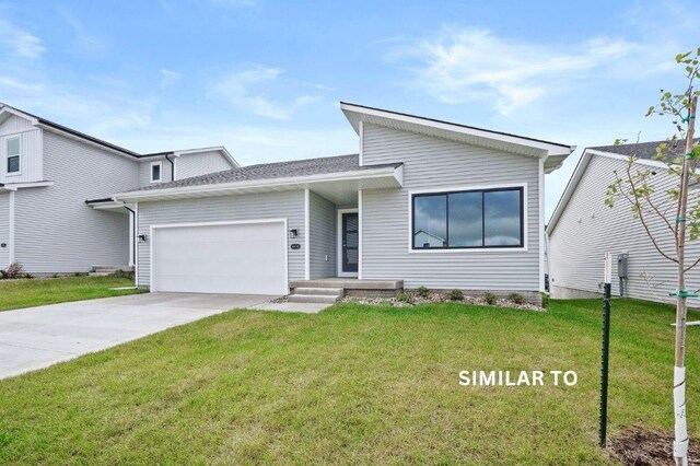 1927 20th Ave SE, Altoona, IA 50009 - view of front facade featuring an attached garage, a front lawn, and concrete driveway