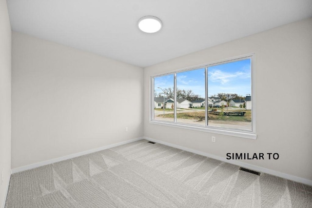 1927 20th Ave SE, Altoona, IA 50009 - unfurnished room with baseboards and carpet floors
