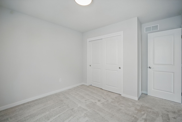 4270 Grover Woods Ln, Des Moines, IA 50317 - unfurnished bedroom with light carpet and a closet