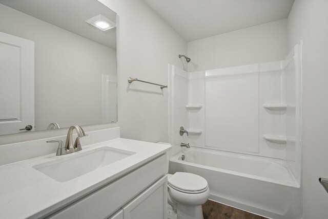 4270 Grover Woods Ln, Des Moines, IA 50317 - full bathroom with vanity, wood finished floors, and bathing tub / shower combination