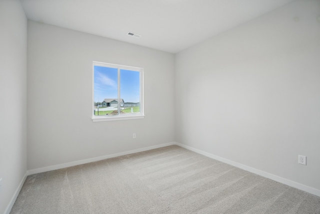 4270 Grover Woods Ln, Des Moines, IA 50317 - spare room featuring carpet floors and baseboards