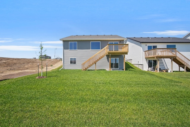 4270 Grover Woods Ln, Des Moines, IA 50317 - back of house with stairway, a wooden deck, and a lawn