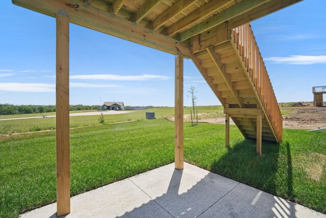 4270 Grover Woods Ln, Des Moines, IA 50317 - view of patio / terrace featuring stairs and a rural view
