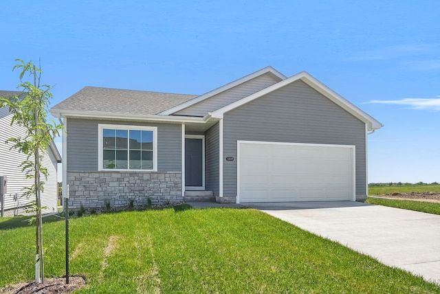 4270 Grover Woods Ln, Des Moines, IA 50317 - view of front of home featuring a front yard, a garage, driveway, stone siding, and roof with shingles