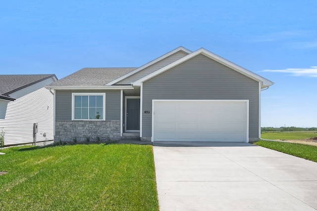 4270 Grover Woods Ln, Des Moines, IA 50317 - view of front of property with driveway, a front lawn, an attached garage, stone siding, and roof with shingles