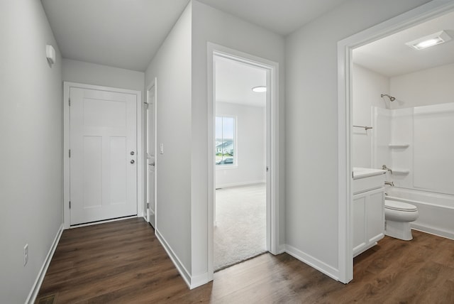 4270 Grover Woods Ln, Des Moines, IA 50317 - hall featuring dark wood finished floors and baseboards