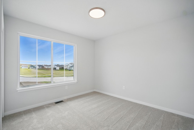 4270 Grover Woods Ln, Des Moines, IA 50317 - carpeted empty room featuring baseboards