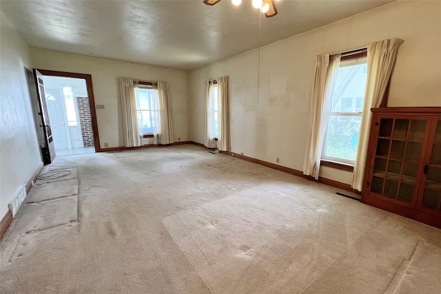 702 W 6th St S, Newton, IA 50208 - carpeted empty room featuring ceiling fan and baseboards