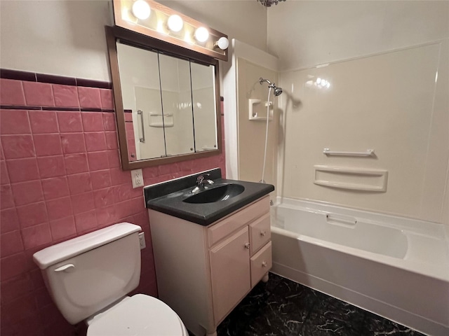 702 W 6th St S, Newton, IA 50208 - full bathroom featuring vanity, shower / washtub combination, marble finish flooring, and tile walls