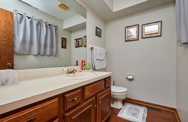 4718 71st St, Urbandale, IA 50322 - bathroom featuring wood finished floors and vanity