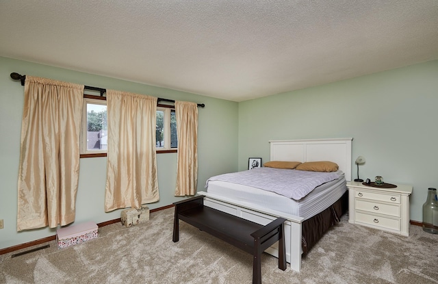 4718 71st St, Urbandale, IA 50322 - carpeted bedroom with a textured ceiling