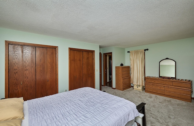 4718 71st St, Urbandale, IA 50322 - carpeted bedroom featuring multiple closets