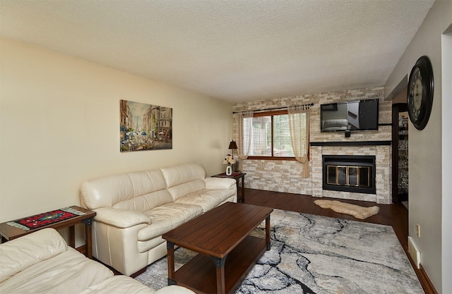 4718 71st St, Urbandale, IA 50322 - living area featuring a fireplace and a textured ceiling