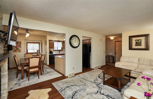 4718 71st St, Urbandale, IA 50322 - living area featuring dark wood-style floors and a textured ceiling