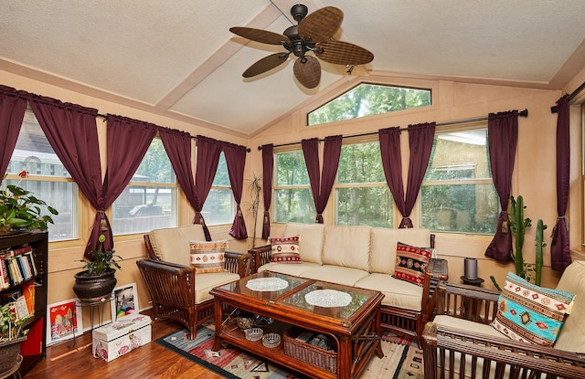 4718 71st St, Urbandale, IA 50322 - living room with lofted ceiling, a ceiling fan, wood finished floors, and a textured ceiling