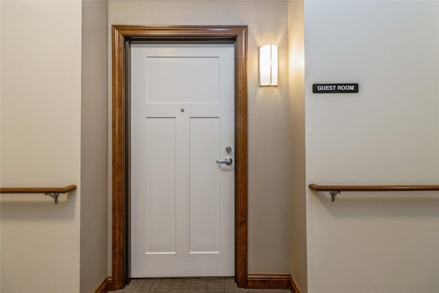 1250 SW Magazine Rd Unit 215, Ankeny, IA 50023 - stairway with baseboards and carpet