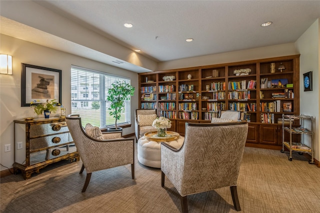 1250 SW Magazine Rd Unit 215, Ankeny, IA 50023 - sitting room featuring light carpet and recessed lighting